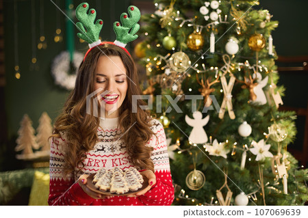 happy trendy housewife in modern house happy trendy housewife in modern house 107069639