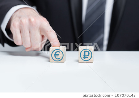 Wooden blocks with currency icons Wooden blocks with currency icons 107070142