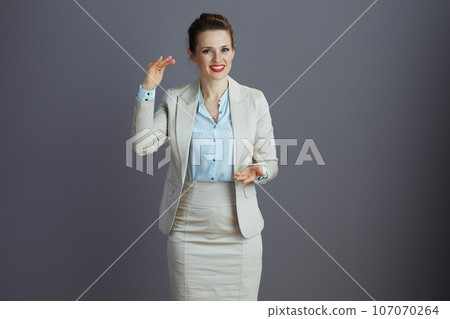 smiling trendy woman employee discussing and gesticulating smiling trendy woman employee discussing and gesticulating 107070264