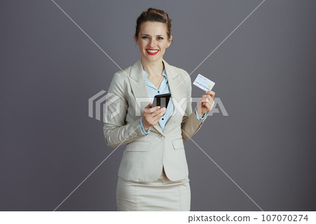 happy elegant woman worker in light business suit happy elegant woman worker in light business suit 107070274