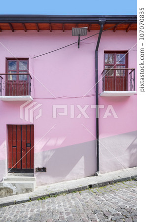 Street view of the facade of an old colonial building, Quito, Ecuador. Street view of the facade of an old colonial building, Quito, Ecuador. 107070835