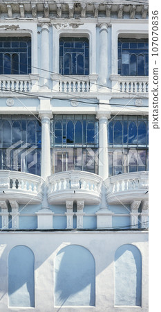 Street view of the facade of an old colonial building, Quito, Ecuador. Street view of the facade of an old colonial building, Quito, Ecuador. 107070836