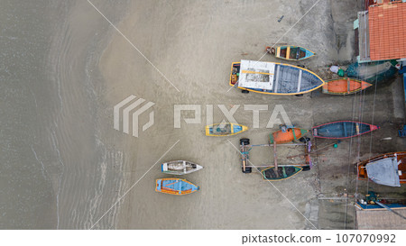 Aerial great view at empty fishermen boats during low tide on the sea Aerial great view at empty fishermen boats during low tide on the sea 107070992