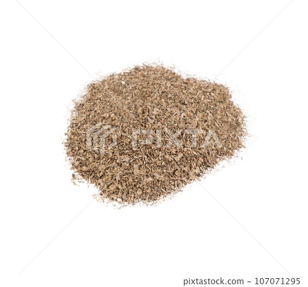 a small pile of dried oregano a small pile of dried oregano 107071295
