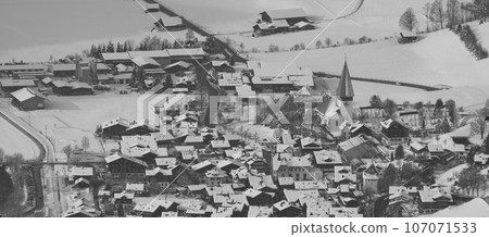 Saanen, village near Gstaad in winter. Saanen, village near Gstaad in winter. 107071533