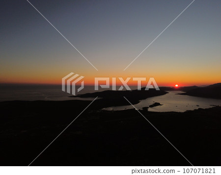 Aerial drone view of beautiful sunset or sunrise landscape with clear sky in the Bay of Kotor, Adriatic sea, Montenegro. Tranquil skyline with bright orange sunlight. Summer holiday concept Aerial drone view of beautiful sunset or sunrise landscape with clear sky in the Bay of Kotor, Adriatic sea, Montenegro. Tranquil skyline with bright orange sunlight. Summer holiday concept 107071821