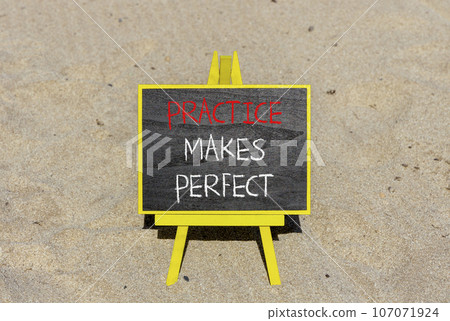 Practice makes perfect symbol. Concept words Practice makes perfect on beautiful black chalk blackboard. Beautiful sand background. Business practice makes perfect concept. Copy space. Practice makes perfect symbol. Concept words Practice makes perfect on beautiful black chalk blackboard. Beautiful sand background. Business practice makes perfect concept. Copy space. 107071924