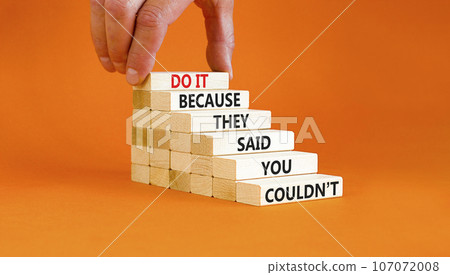 You can do it symbol. Concept words Do it because they said you could not on wooden block. Beautiful orange table background. Businessman hand. Business, motivational you can do it concept. Copy space You can do it symbol. Concept words Do it because they said you could not on wooden block. Beautiful orange table background. Businessman hand. Business, motivational you can do it concept. Copy space 107072008