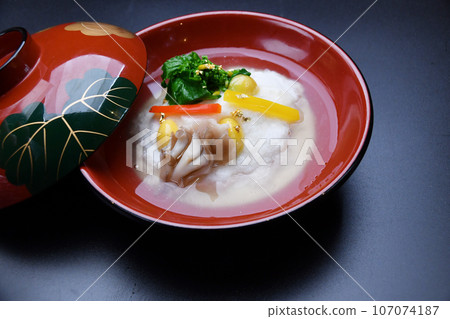 Japanese cuisine served at a restaurant: Steamed turnip with silver bean paste 107074187