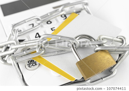 Calculator, chain and credit card Calculator, chain and credit card 107074411