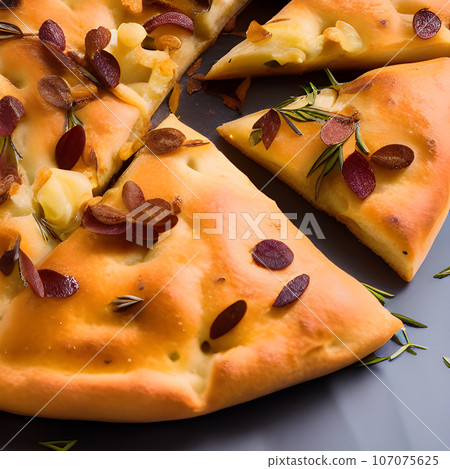 Italian focaccia bread with rosemary and garlic served on plate 107075625
