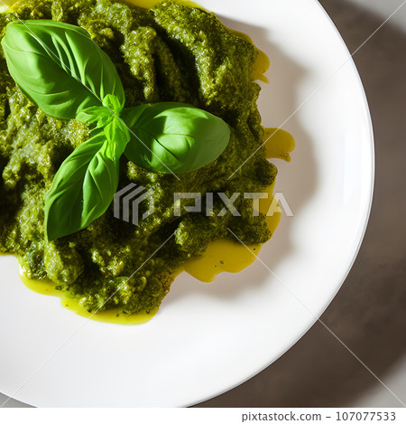 pesto alla genovese served on plate ingredients parmesan basil pine nuts pesto alla genovese served on plate ingredients parmesan basil pine nuts 107077533