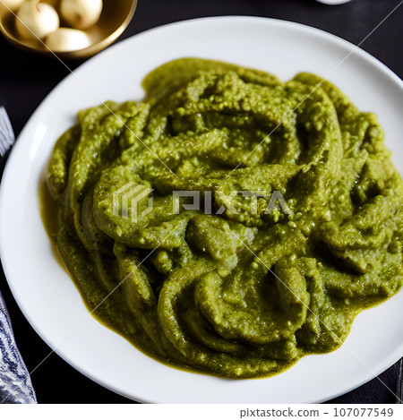 pesto alla genovese served on plate ingredients parmesan basil pine nuts pesto alla genovese served on plate ingredients parmesan basil pine nuts 107077549