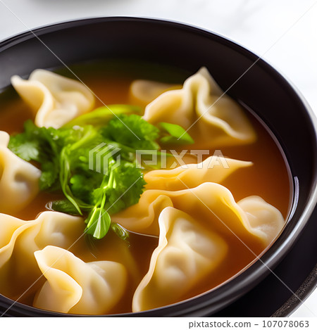 Shrimp dumplings with wonton soup delicious served on bowl 107078063