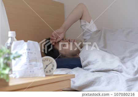 A man who falls asleep due to poor physical condition A man who falls asleep due to poor physical condition 107080216