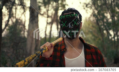 Assassins Masked man in the forest find his victim Assassins Masked man in the forest find his victim 107083705