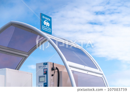 EV charging spot electric car quick charger EV QUICK CHARGER blue sky EV charging spot electric car quick charger EV QUICK CHARGER blue sky 107083739