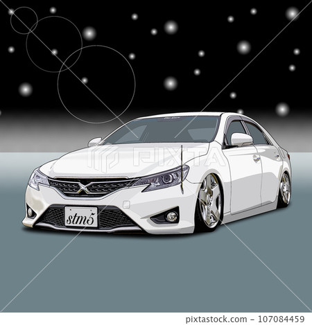 A white sports car driving along the coast with its lights on at night A white sports car driving along the coast with its lights on at night 107084459