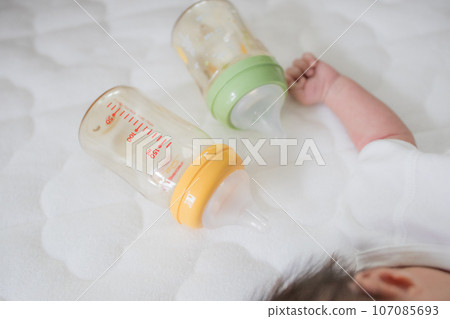 newborn baby and baby bottle newborn baby and baby bottle 107085693