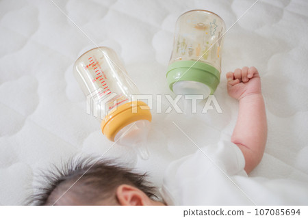 newborn baby and baby bottle newborn baby and baby bottle 107085694