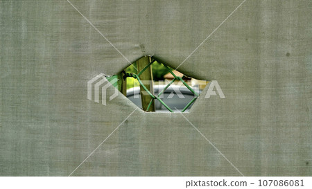 tear holes in canvas used outdoors 107086081