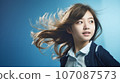 Hair fluttering in the wind, a female student's hope for the future 107087573
