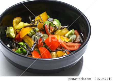 Okra and cherry tomatoes dressed with salted kelp Okra and cherry tomatoes dressed with salted kelp 107087710