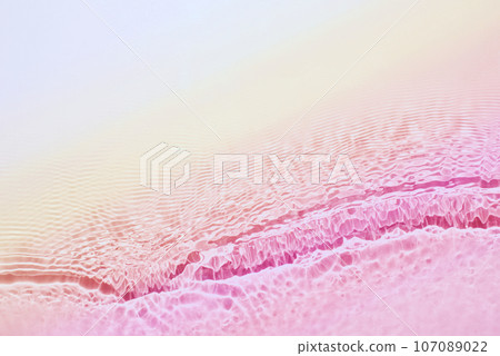 The texture of water on a pink background. The texture of water on a pink background. 107089022