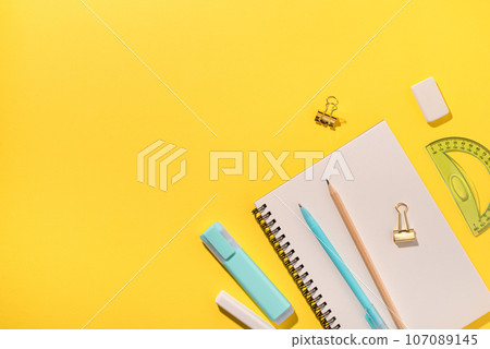 School supplies on yellow background. 107089145