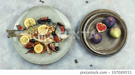 Tasty roasted dorado or gilt head bream fish Tasty roasted dorado or gilt head bream fish 107089551