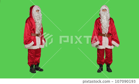 Father christmas disappointment, saying no and showing disagreement. Young man portraying santa claus with costume acting displeased and frustrated, does dislike gesture on greenscreen. Father christmas disappointment, saying no and showing disagreement. Young man portraying santa claus with costume acting displeased and frustrated, does dislike gesture on greenscreen. 107090193