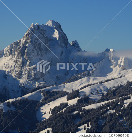 Winter day in the Saanenland Valley, Switzerland. 107090498