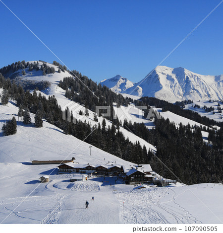 Snow landscape and ski slope near Gstaad, Switzerland. 107090505