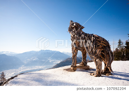 Wooden sculpture of a wolf. Italian landmark 107092204