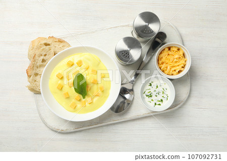 Tasty lunch concept with delicious cheese soup Tasty lunch concept with delicious cheese soup 107092731