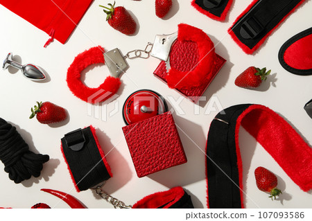 A collection of sex toys on a light background. A collection of sex toys on a light background. 107093586