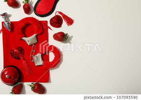 A collection of sex toys on a light background. A collection of sex toys on a light background. 107093590