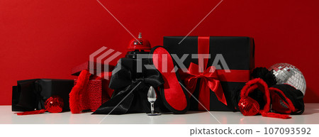 A collection of sex toys on a red background. A collection of sex toys on a red background. 107093592