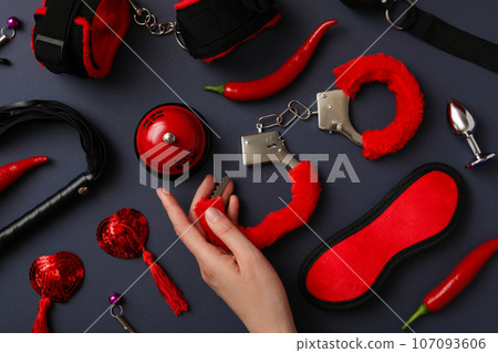 A collection of sex toys on a dark background. 107093606
