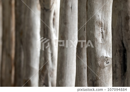 Abstract wooden construction of white logs in a row Abstract wooden construction of white logs in a row 107094884