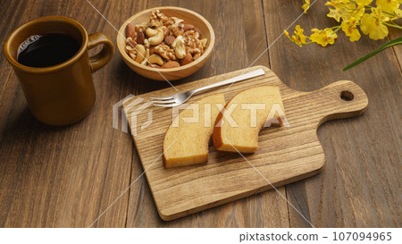 Coffee, Baumkuchen and mixed nuts Coffee, Baumkuchen and mixed nuts 107094965