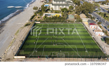 Aerial drone view at the football field near the sea at Alanya. 107096347
