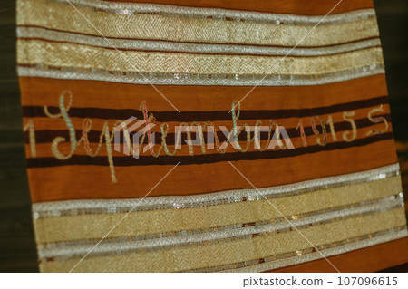 woman is weaving cloth, or so-called traditional tapis cloth, typical of Lampung province, by hand 107096615