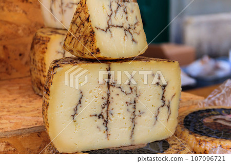 Truffle cheese for sale at a local market 107096721