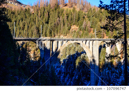 View of Wiesen Viaduct, Rhaetian railway, Graubunden in Switzerland at winter 107096747