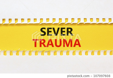 Sever trauma symbol. Concept words Sever trauma on yellow paper. Beautiful white background. Psychological and sever trauma concept. Copy space. 107097608
