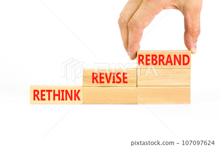 Rethink revise rebrand symbol. Concept word Rethink Revise Rebrand on beautiful block. Beautiful white table white background. Business brand motivational rethink revise rebrand concept. Copy space. 107097624