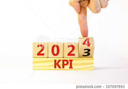 KPI, key performance indicator symbol. Businessman turns wooden cubes with words KPI 2023 and KPI 2024 on beautiful white background, copy space. Business KPI key performance indicator concept. 107097691