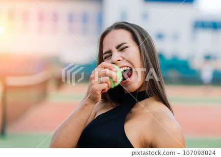 Beautiful stylish sexy woman in trendy sportswear on tennis court. Beautiful stylish sexy woman in trendy sportswear on tennis court. 107098024