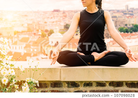 Healthy woman in sportswear practicing yoga outdoor, doing exercise, full length portrait. 107098028